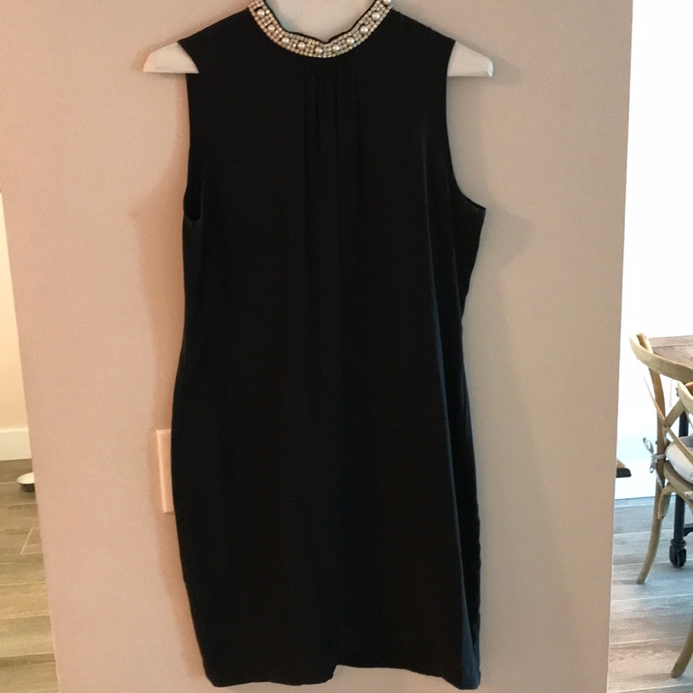 Black silk dress with jeweled neckline.